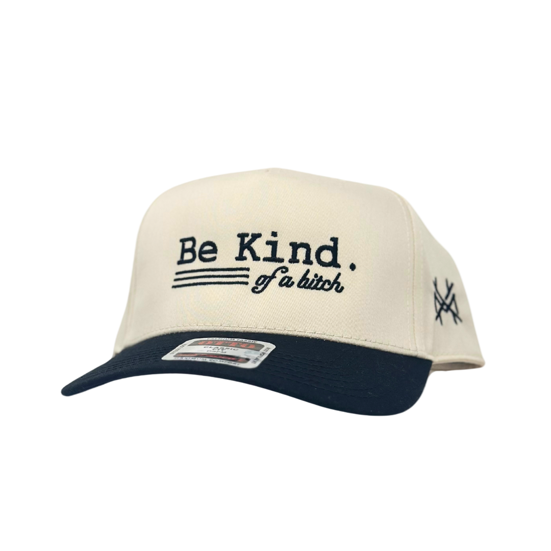 Cap with 'Be Kind. Be a bitch' text on a white background