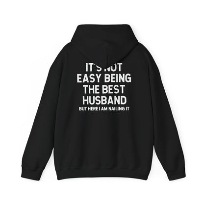 Back view of Best Husband Hoodie with text: It's Not Easy Being The Best Husband But Here I Am Nailing It.