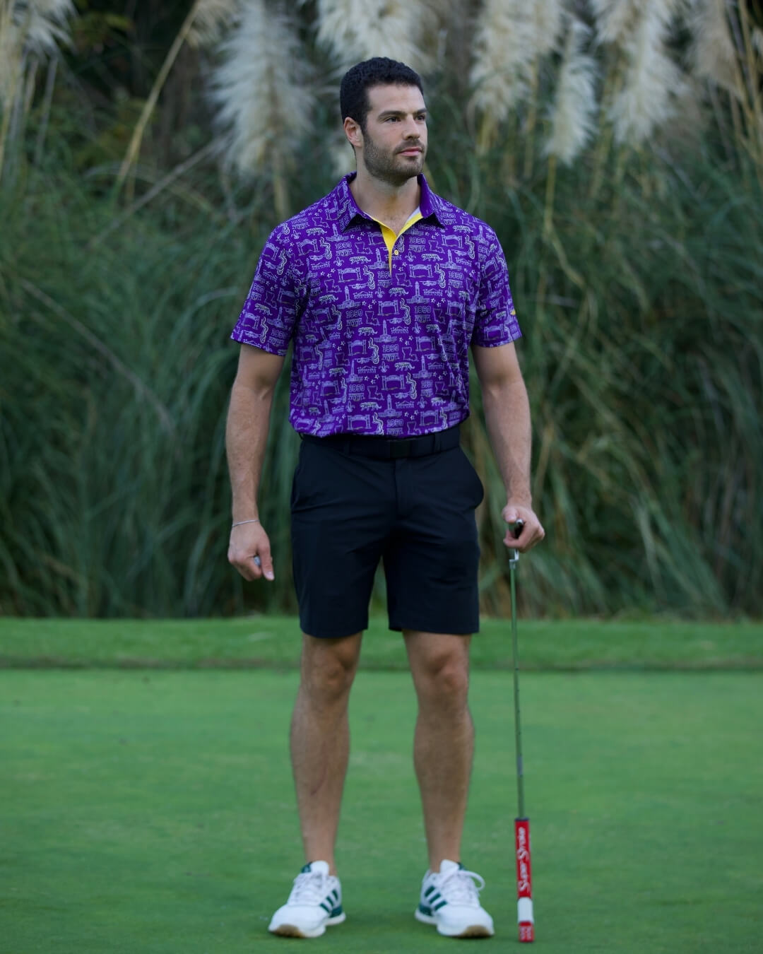 Man wearing Baton Rouge football polo shirt by Haven Golf on a golf course
