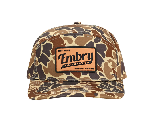Duck Camo 6 Panel "Retro" Trucker hat with Embry Outdoors logo, featuring unique camo pattern and polyester material.