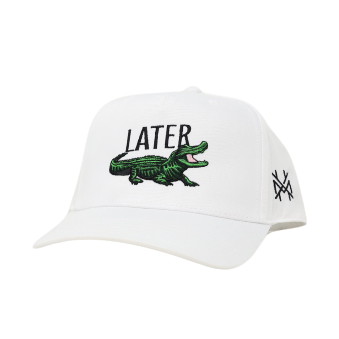 White cap with green alligator and 'LATER' text on a white background