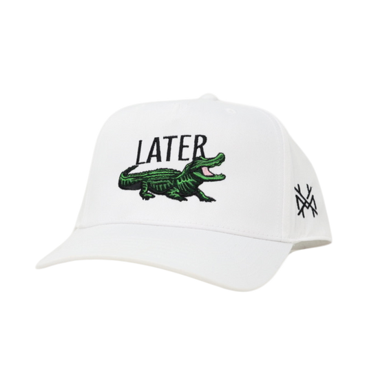 White cap with green alligator and 'LATER' text on a white background