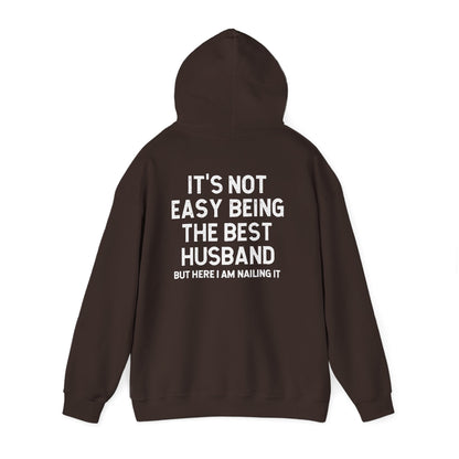 Best Husband Hoodie featuring the phrase "It's Not Easy Being The Best Husband But Here I Am Nailing It."