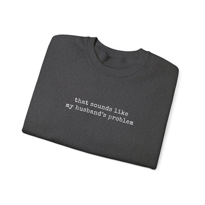 That Sounds Like My Husband's Problem Sweatshirt displayed in folded form with typewriter-style text.