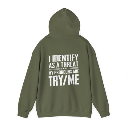 I Identify as a Threat Hoodie with 'Try Me' graphic in bold white text on green fabric, conveying a pro-gun message.