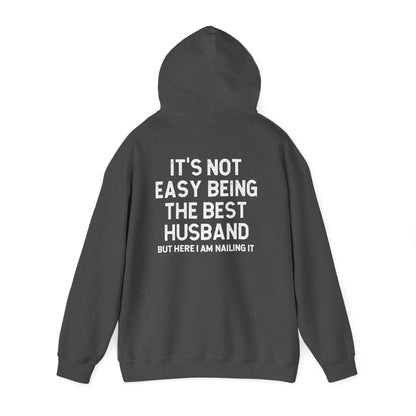 Best Husband Hoodie featuring text on the back: "It's Not Easy Being THE BEST HUSBAND But Here I Am Nailing It."