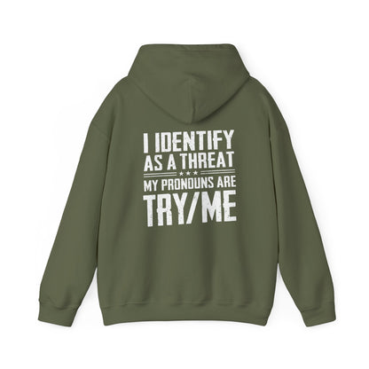 I Identify as a Threat Hoodie with 'Try Me' pronouns graphic in olive green, funny pro gun statement wear, Second Amendment humor apparel.