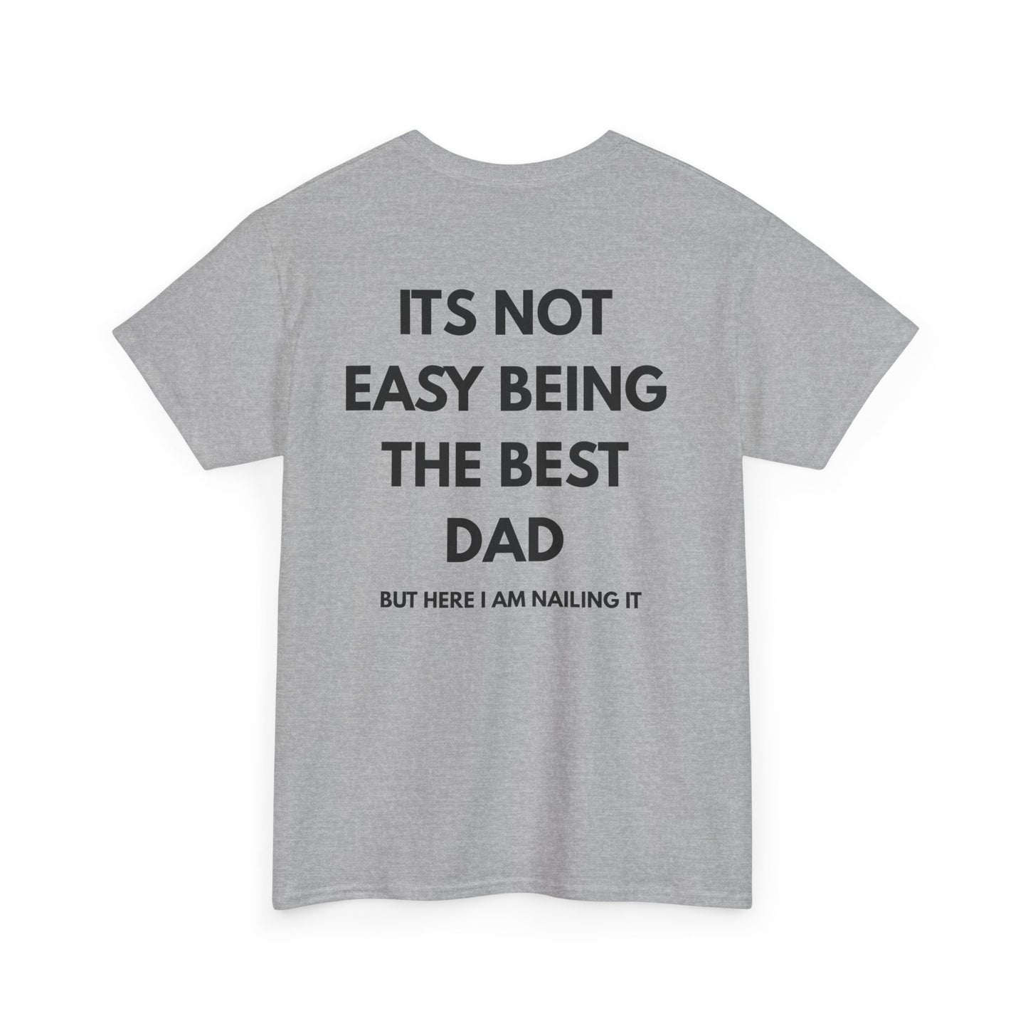 Not Easy Being The Best Dad But Here I Am Nailing It Shirt displayed on a gray t-shirt.