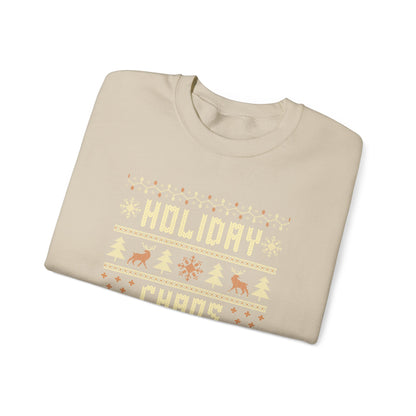 Holiday Chaos Coordinator Sweatshirt displayed in a folded beige crewneck with festive holiday design.