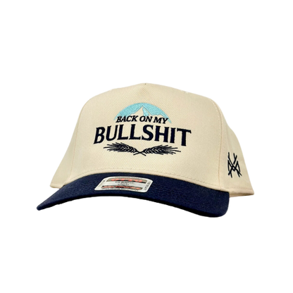 Beige and navy cap with text and logo on a white background