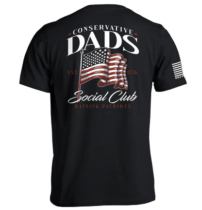 Conservative Dads Social Club T-Shirt featuring a waving American flag design and patriotic text on back view.