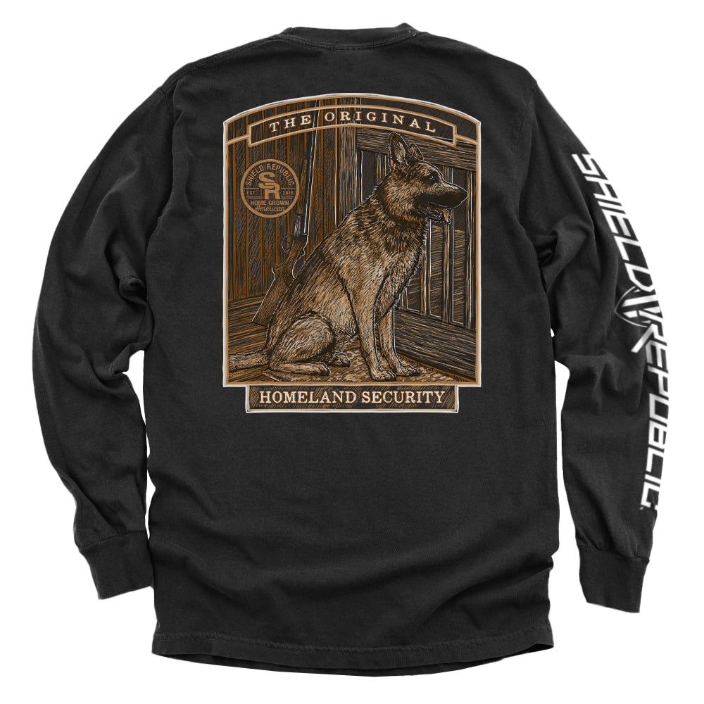 The Original Homeland Security Dog T-Shirt featuring a vintage-style illustration of a loyal dog standing guard on a black long sleeve.