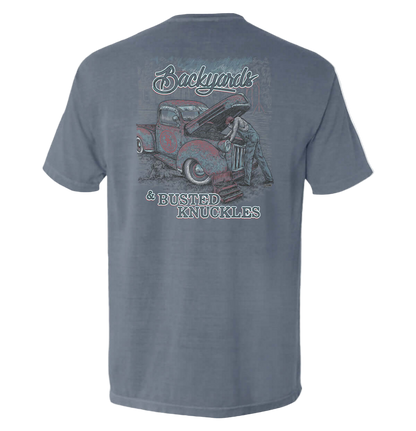 Gray t-shirt with a graphic of a man working on a truck and text on the back, on a white background.