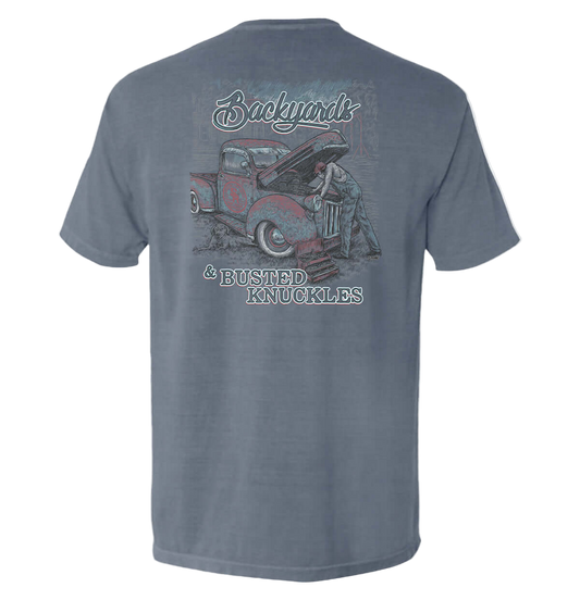 Gray t-shirt with a graphic of a man working on a truck and text on the back, on a white background.