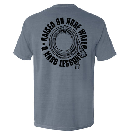 Back of Raised On Hose Water & Hard Lessons Shirt with hose graphic, blue color, perfect for blue collar nostalgia.