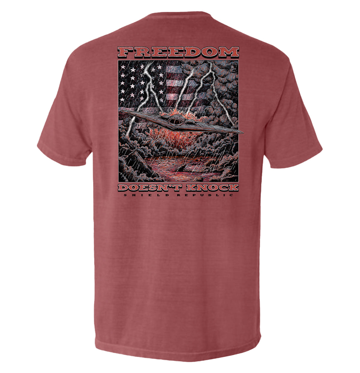 Freedom Doesn’t Knock Shirt with dramatic graphic of lightning and American flag on a stormy background, showcasing strength and independence.