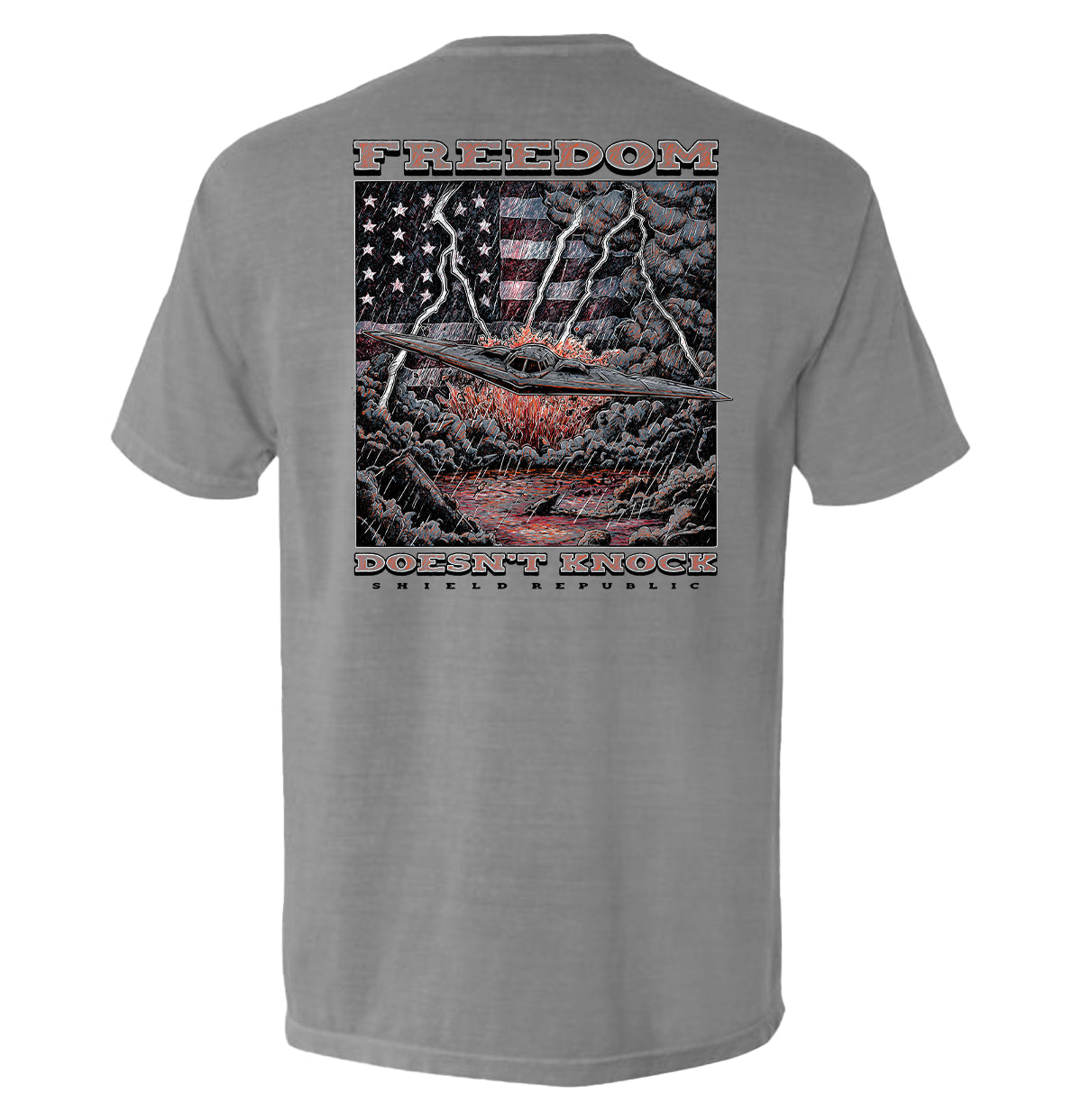 Freedom Doesn’t Knock Shirt with dramatic graphic, patriotic elements, stormy sky design, emphasizing liberty and strength.