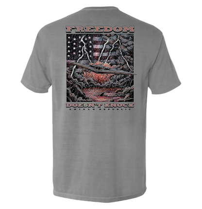 Freedom Doesn’t Knock Shirt with patriotic stormy sky graphic on back