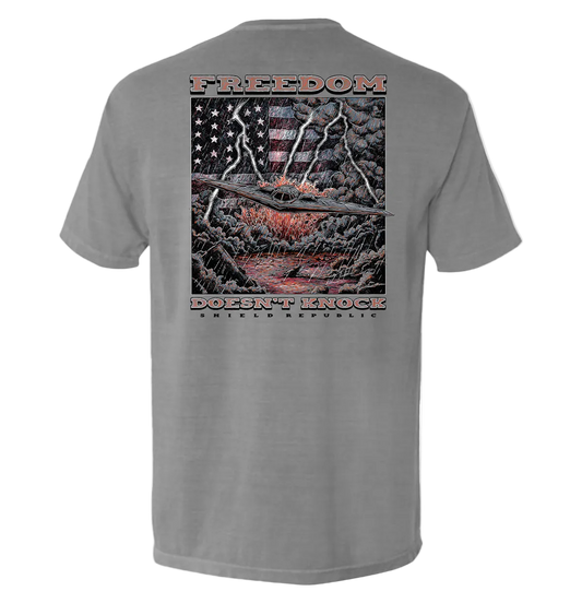 Freedom Doesn’t Knock Shirt with patriotic stormy sky graphic on back