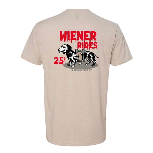 Beige t-shirt with 'Wiener Rides' graphic and text on the back, brand 'The Mad Hatter Co.' visible.
