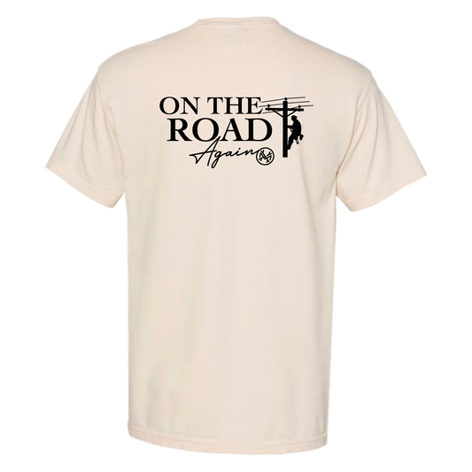 Beige t-shirt with 'On The Road Again' graphic on a white background