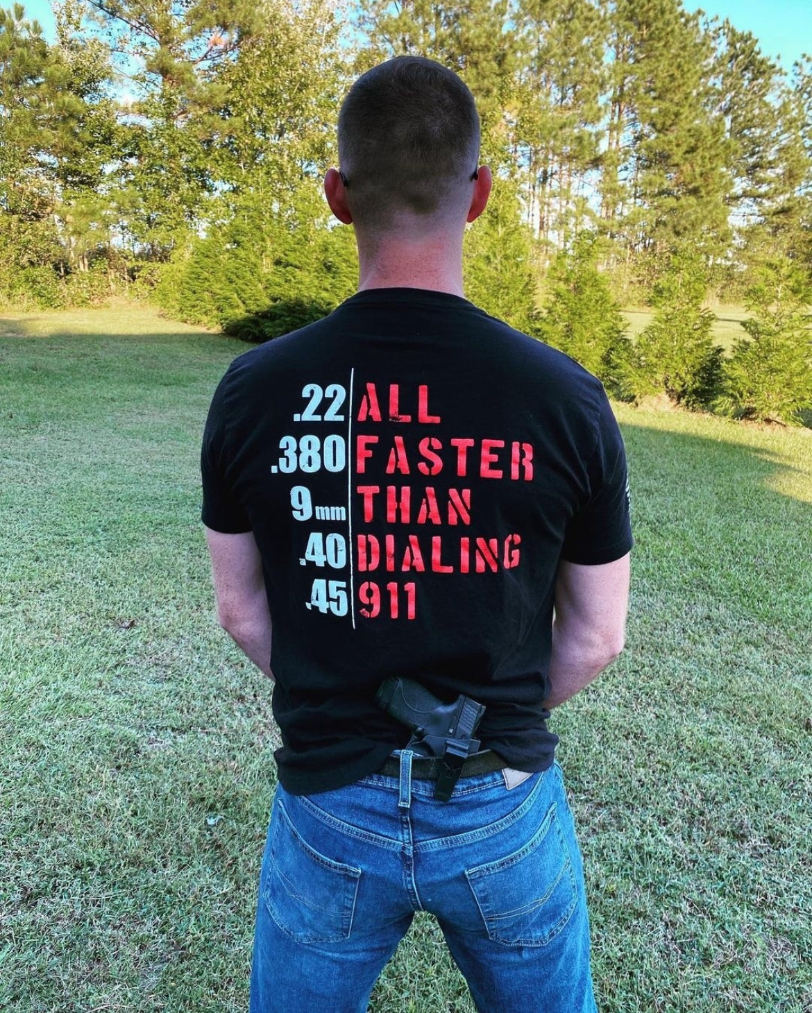 man with shirt text all faster than dialing 911
