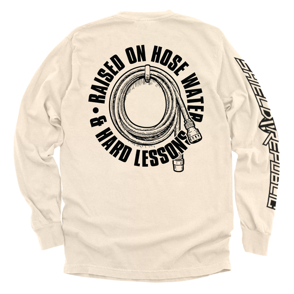 Back view of Raised On Hose Water & Hard Lessons Shirt featuring a hose graphic on a beige long-sleeve tee.
