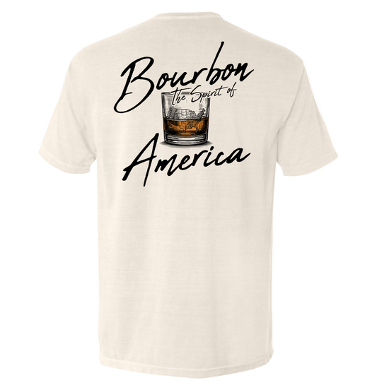 Beige t-shirt with 'Bourbon the Spirit of America' text and whiskey glass graphic on a white background