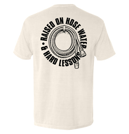 Back view of Raised On Hose Water & Hard Lessons Shirt showcasing blue collar nostalgia design.