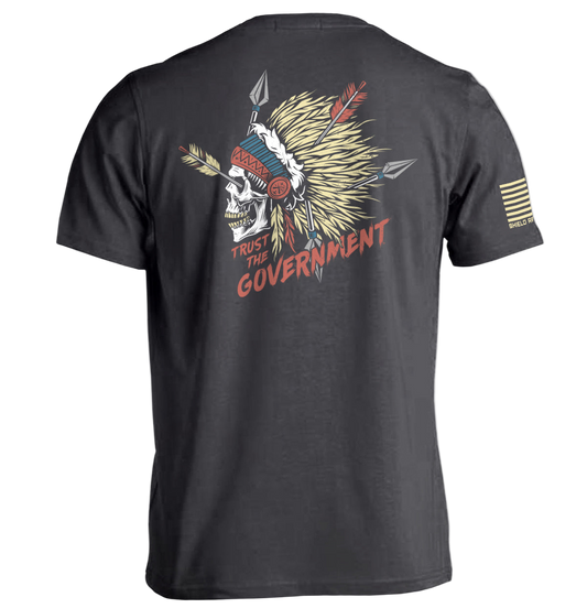 Black t-shirt with a graphic design on the back featuring a skull with feathers and arrows, and text 'Trust the Government'.