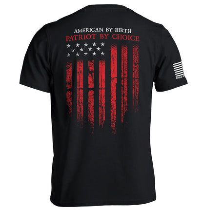 Patriot shirt American flag tee with distressed flag graphic and 'American By Birth, Patriot By Choice' text on black background.