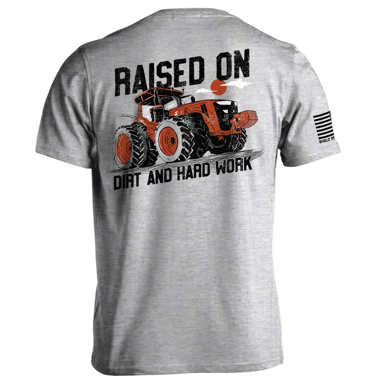 Gray t-shirt with graphic of a tractor and text 'Raised on Dirt and Hard Work' on a white background