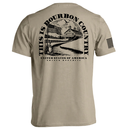 Beige t-shirt with black graphic and text on a white background