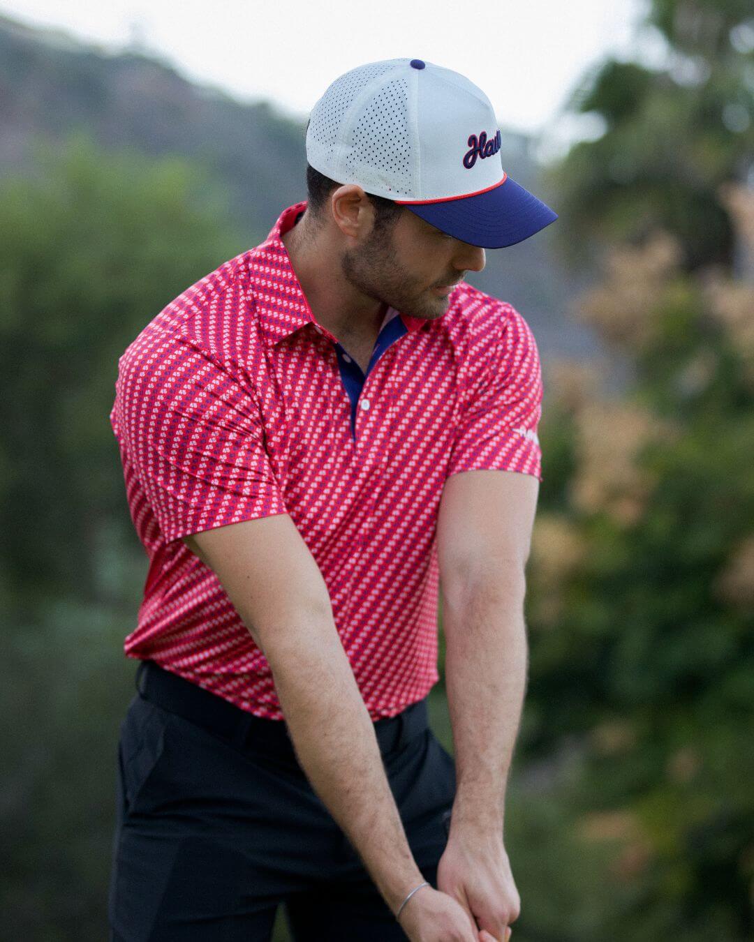 Man wearing 45 Polo Shirt – The Don by Haven Golf, red and white with performance fabric, perfect for patriotic golfing.