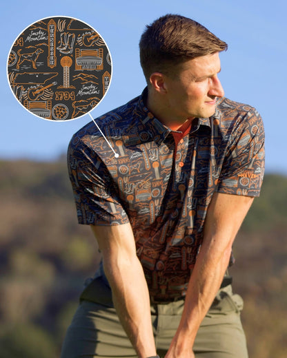 Man wearing Tennessee football polo shirt by Haven Golf with Smokey Knoxville design in outdoor setting