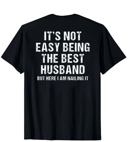 Black t-shirt with white text on a white background
